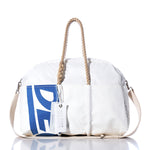 The Vintage Ideal18 Weekender by Sea Bags features blue lettering, sturdy rope handles, a removable shoulder strap, and a signature SEA BAGS tag. Photographed on a white background, its the perfect bag for getaways or weekend adventures. by Sea Bags