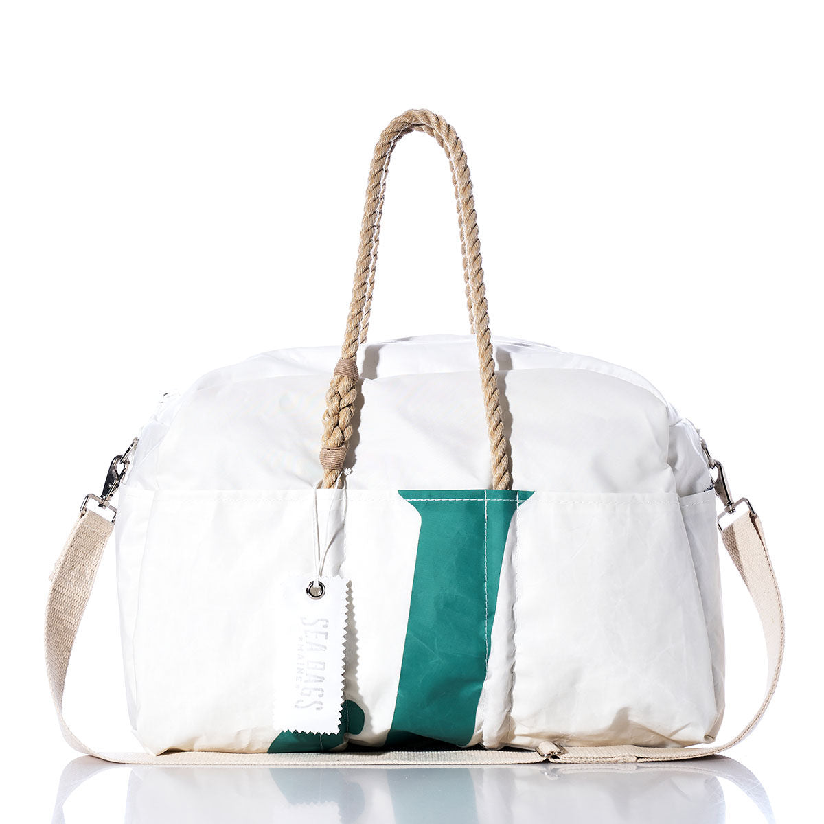 Getaway-ready and displayed on a crisp white background, the Sea Bags Vintage J80 Weekender features hemp handles, a green vertical stripe, and a detachable shoulder strap. by Sea Bags