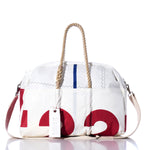 The Sea Bags Vintage Etchells 22 Weekender is a white duffel bag featuring red, blue, and black graphic accents. It includes sturdy rope and durable hemp handles, a detachable shoulder strap, and a white tag labeled SEA BAGS. Inspired by the classic Etchells 22 design, this getaway bag is displayed against a white background. by Sea Bags