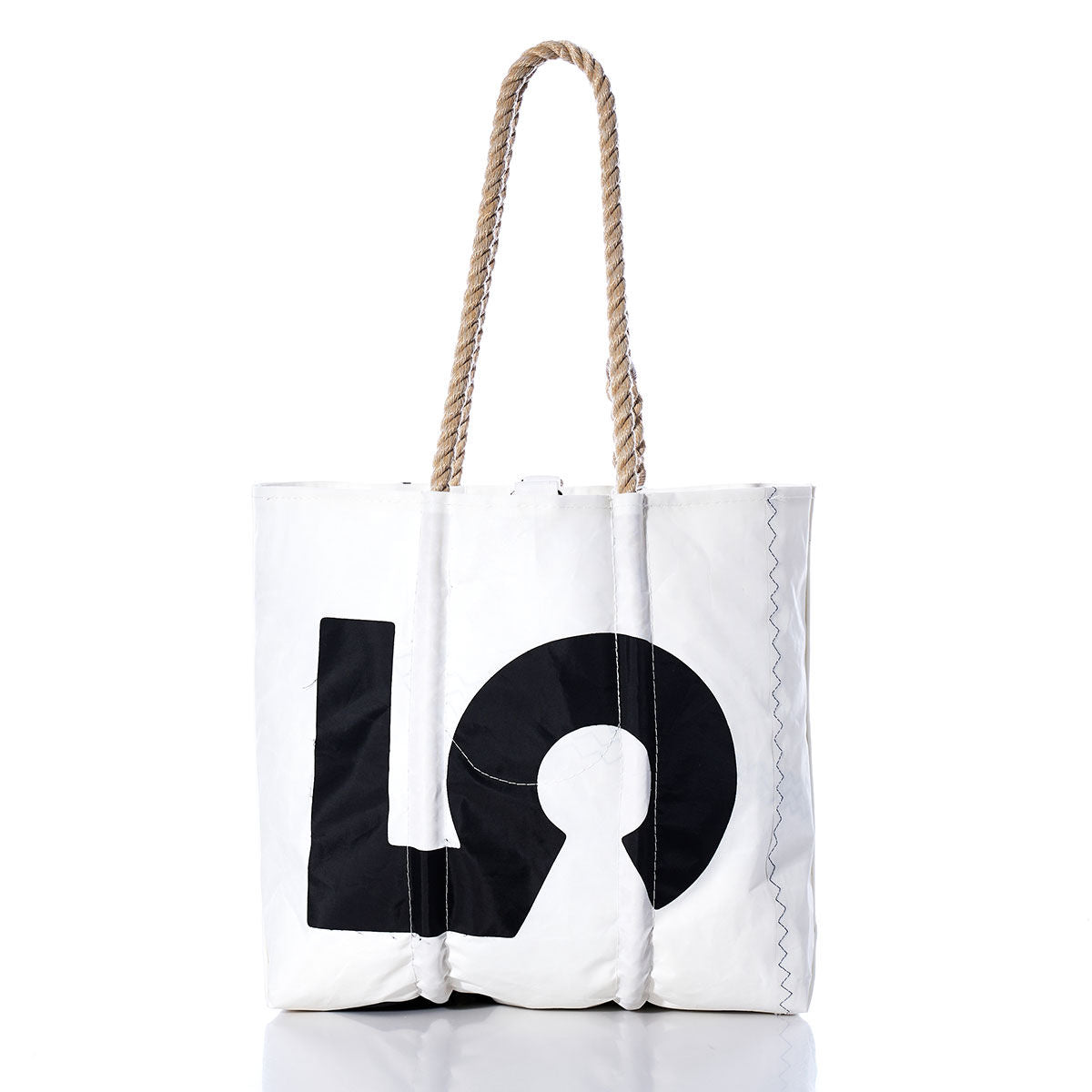 Sea Bags’ Vintage 375 Medium Tote showcases thick, hand-spliced rope handles, visible stitching details, and a bold black “LO” graphic on classic white—a true tribute to vintage sail totes and Maine’s legacy of handcrafted bags. by Sea Bags