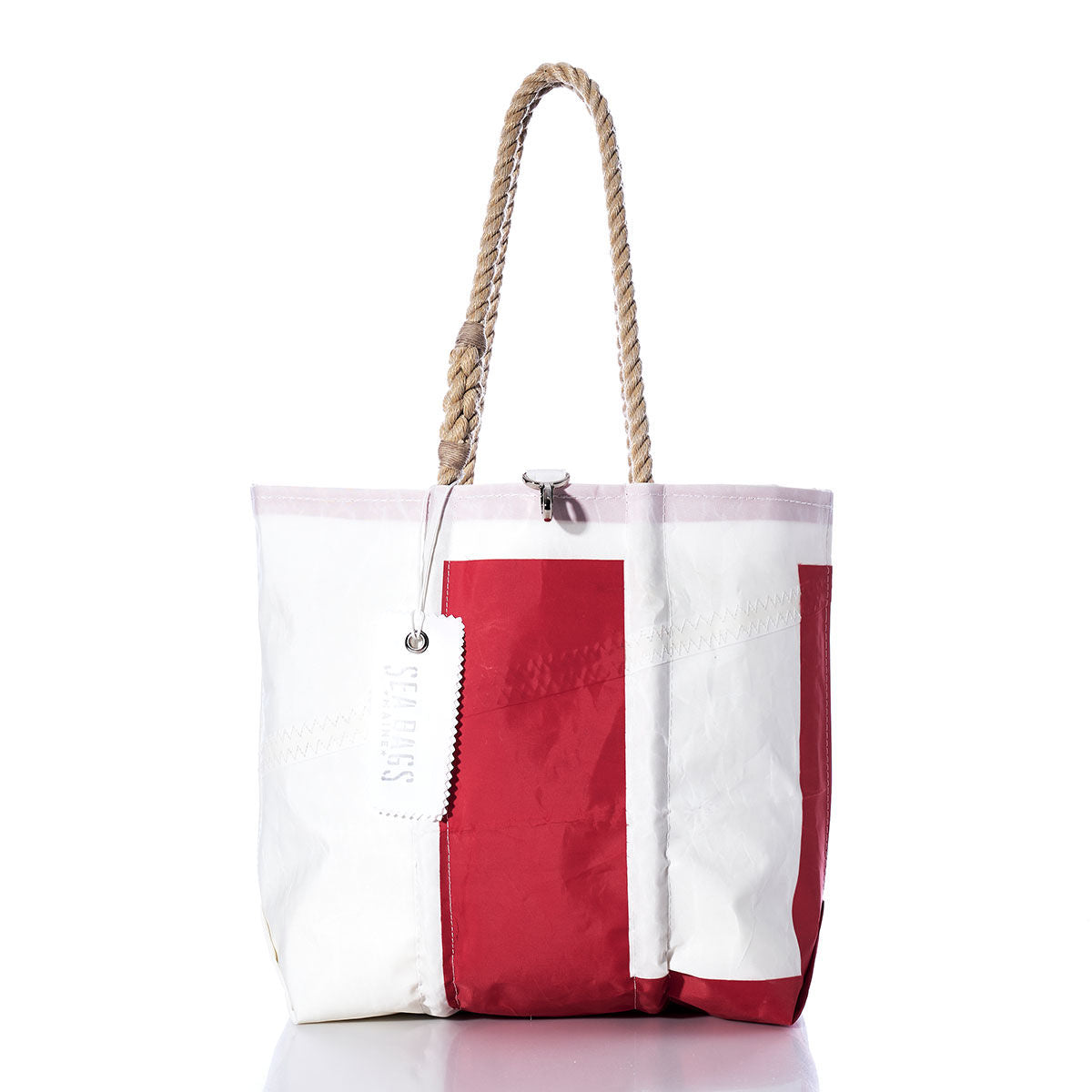 Sea Bags Vintage UE Medium Tote, a white and red handcrafted bag made in Maine from durable sailcloth, features rope handles, a zipper closure, and a visible white tag, displayed against a plain white background. by Sea Bags