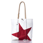 Sea Bags Vintage Red Star Medium Tote—crafted from white sailcloth, this handmade Maine tote features a striking red star motif, durable rope handles, and a white tag by the handle. Shown against a crisp white background. by Sea Bags