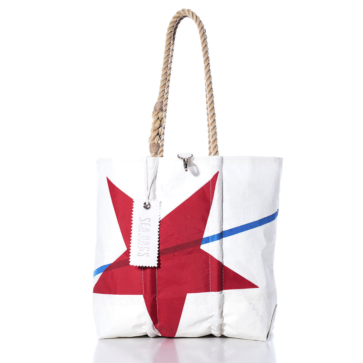 Crafted by Sea Bags, the Vintage Red Star Medium Tote features a white exterior with a red star and blue stripe, original sail insignia, hand-spliced rope handles, and a stitched STARS tag for authentic nautical charm. by Sea Bags