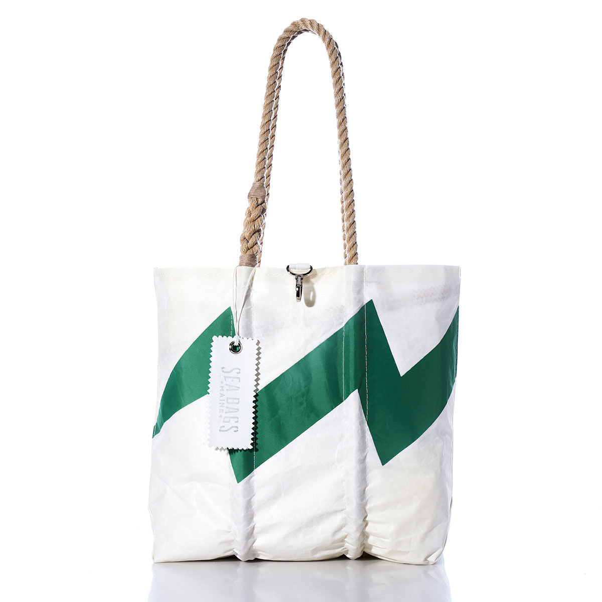 The Sea Bags Vintage Lightning Medium Tote, featuring a green zigzag stripe on white sailcloth, rope handles, and a signature Sea Bags tag, is photographed on a white background. This unique bag is one of our classic handmade Maine creations. by Sea Bags