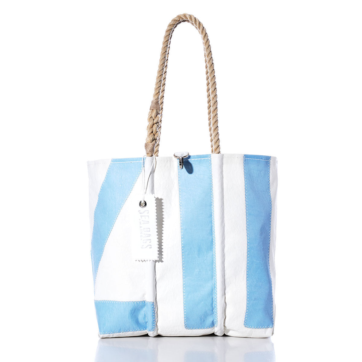 Introducing the Sea Bags Vintage 117 Medium Tote, expertly crafted in Maine. This unique bag features vertical white and light blue panels, sturdy hand-spliced rope handles, and a distinctive white tag. The tote is showcased against a clean white background. by Sea Bags