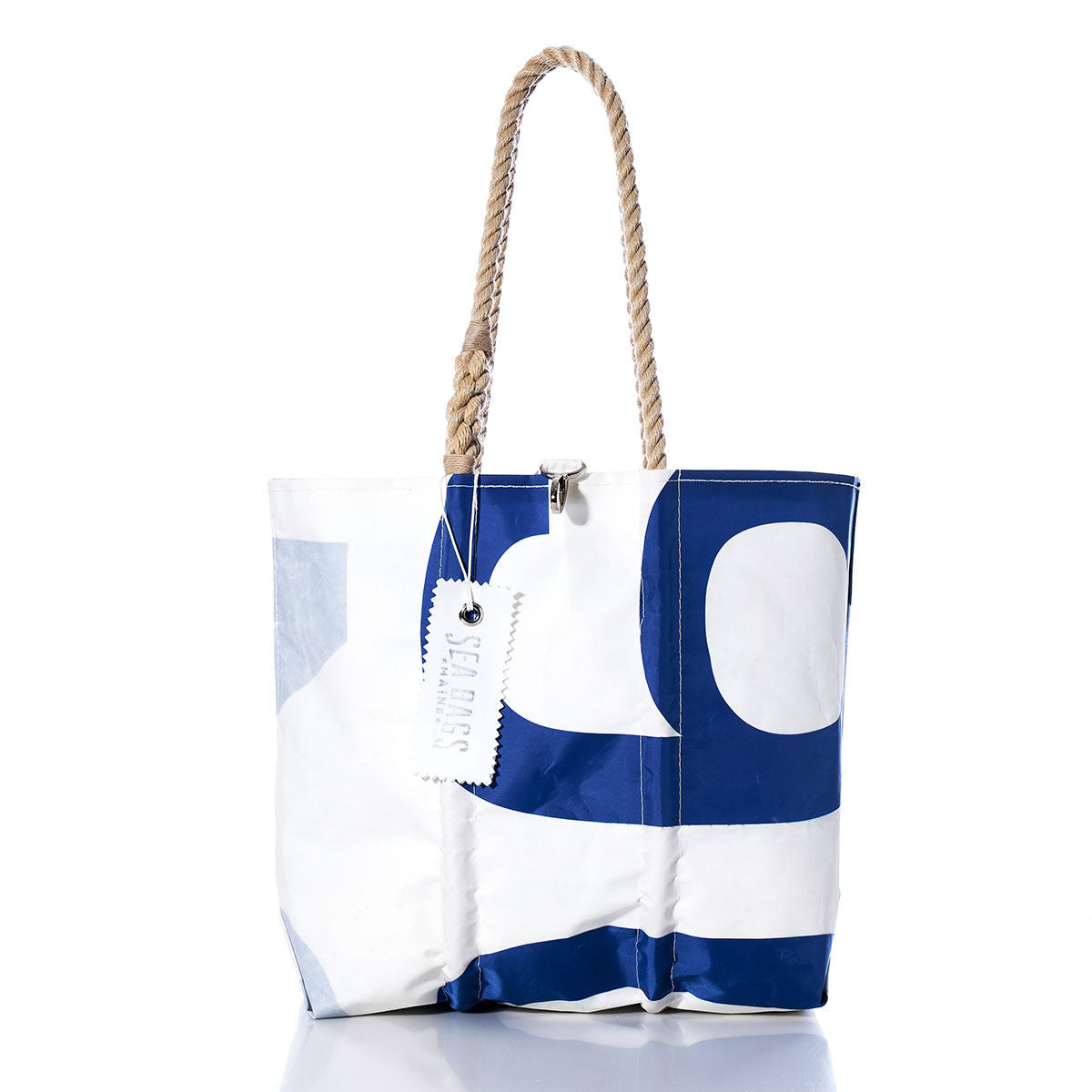 Vintage 904 Medium Tote by Sea Bags, a handmade white and blue sailcloth bag with rope handles and a Sea Bags tag, photographed on a white background. by Sea Bags