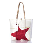 Introducing the Sea Bags Vintage Red Star Medium Tote—a white recycled sailcloth tote bag featuring sturdy rope handles, a bold red star design, and a signature white Sea Bags tag. Expertly handmade in Maine, this tote combines distinctive style with durable craftsmanship. by Sea Bags