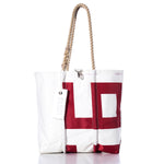 The Sea Bags Vintage 997 Medium Tote, made from white sailcloth with red block lettering, features hand-spliced rope handles and a white tag that reads Sails. This vintage tote is shown against a white background. by Sea Bags
