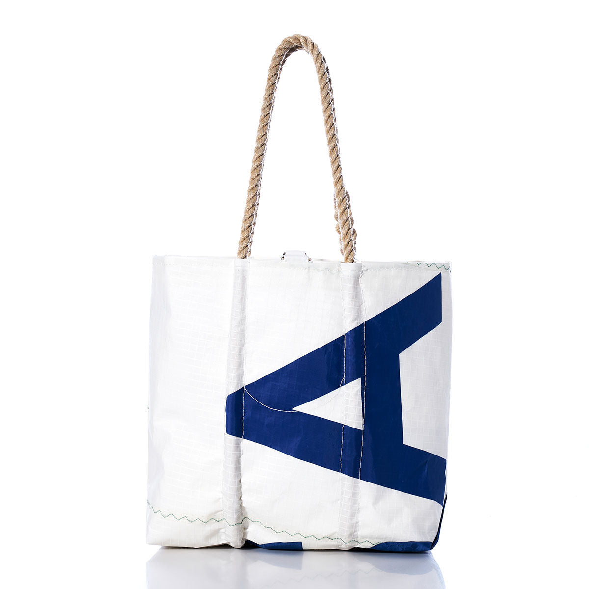 Sea Bags Vintage USA Medium Tote featuring a blue geometric design on white sailcloth, hand-spliced rope handles, and visible front stitching, photographed against a white background. by Sea Bags