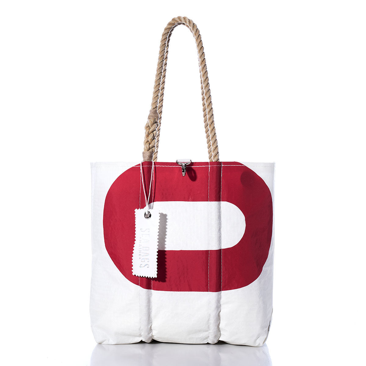 Sea Bags Vintage Red 0 Medium Tote is handcrafted from white sailcloth and features sturdy rope handles, a bold red 0 design on the front, and a white tag attached to one handle for an added touch. by Sea Bags