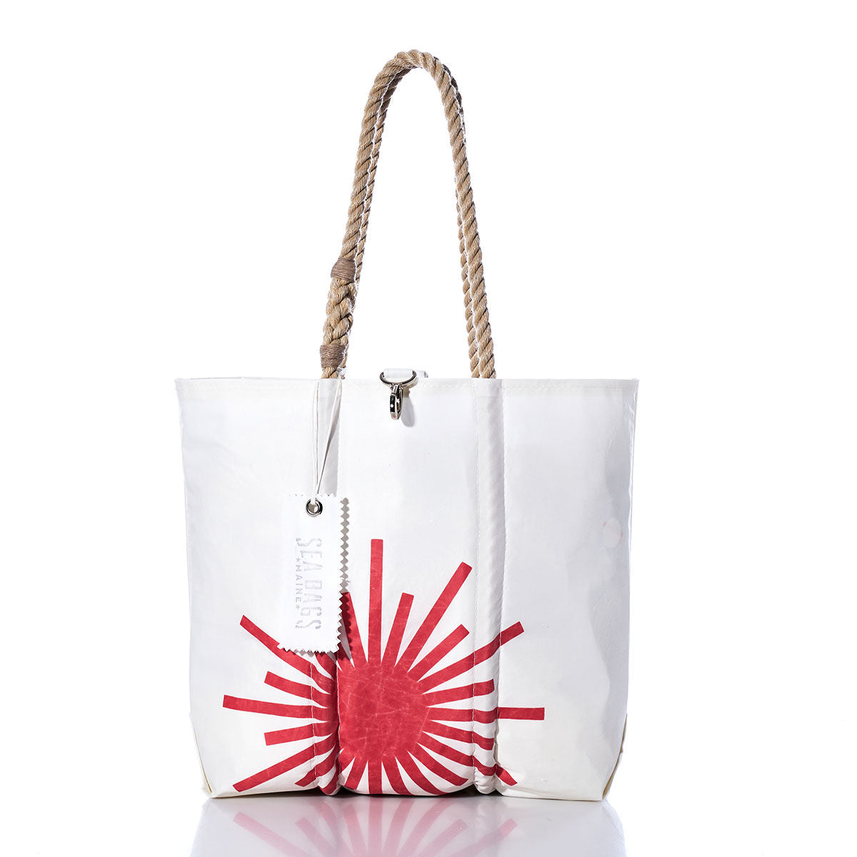Sea Bags Vintage Laser Medium Tote — a white sailcloth bag featuring rope handles and a red sunburst design on the front, handmade in Maine and shown on a white background. by Sea Bags