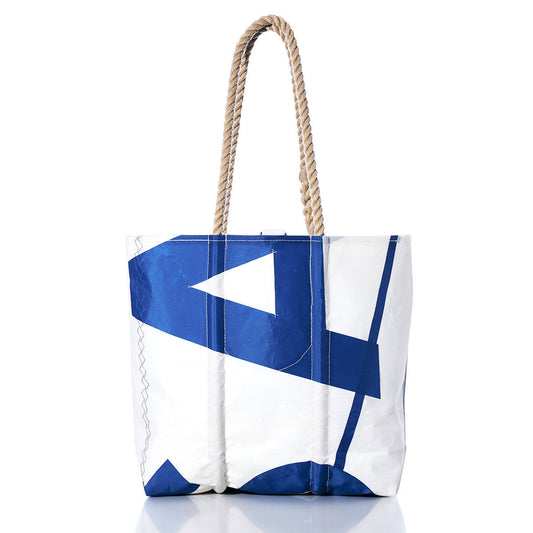 The Sea Bags Vintage USA Medium Tote showcases a white body with a blue geometric pattern and sturdy rope handles, standing upright on a white background. by Sea Bags