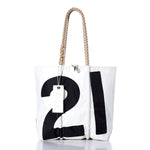 Introducing the Sea Bags Vintage 21 Medium Tote: a handmade white tote bag featuring a bold black number 21, sturdy rope handles, and an attached white tag—photographed on a white background and inspired by timeless nautical style. by Sea Bags