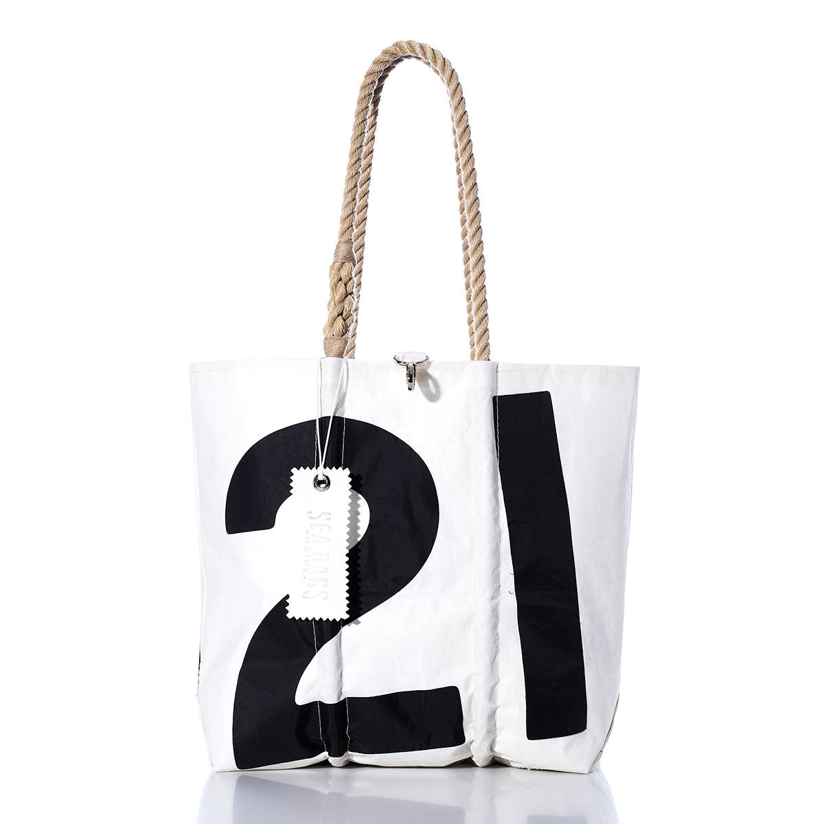 Introducing the Sea Bags Vintage 21 Medium Tote: a handmade white tote bag featuring a bold black number 21, sturdy rope handles, and an attached white tag—photographed on a white background and inspired by timeless nautical style. by Sea Bags