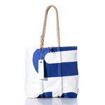 The Vintage USA Medium Tote by Sea Bags is a white and blue sailcloth bag with rope handles and a white tag attached, photographed against a plain white background—an authentic handmade Maine accessory that captures classic coastal style. by Sea Bags