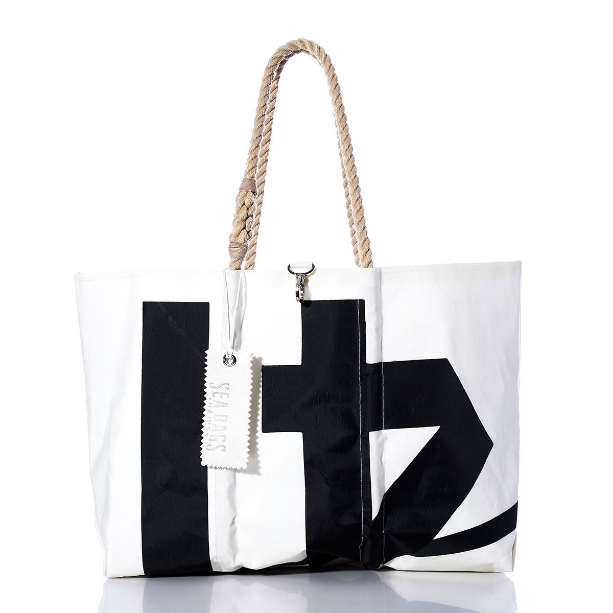 Introducing the Vintage Black 41 Large Tote by Sea Bags—a sailcloth bag featuring a bold black graphic print, braided rope handles, and a white Sea Bags tag near the top. Handmade in Maine for exceptional style and lasting durability. by Sea Bags