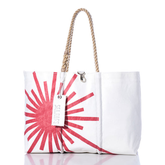 Sea Bags Vintage Laser Large Tote featuring a white body with a bold red sunburst design, hand-spliced rope handles, and a signature white “Sea Bags” tag, photographed against a clean white background. Expertly crafted in Maine, this tote reinvents the classic sail bag with distinctive vintage style. by Sea Bags