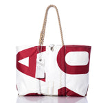 The Sea Bags Vintage USA770 Large Tote features hand-spliced rope handles, a striking red graphic print, and a distinctive SEA BAGS label. Crafted in Maine to echo the classic appeal of vintage sail totes, this white and red bag is photographed on a clean white background. by Sea Bags