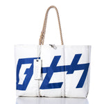 Sea Bags Vintage 470 Large Tote: A handmade Maine bag crafted from white sailcloth, featuring a bold blue graphic print, sturdy rope handles, visible stitching, and a rectangular tag near the top—blending coastal charm with durable craftsmanship. by Sea Bags