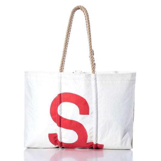 The Sea Bags Vintage Day Sailer Large Tote is a white canvas bag featuring a bold red letter S on the front and sturdy rope handles. Handmade in Maine and inspired by classic sailcloth bag designs, it is photographed against a white background. by Sea Bags