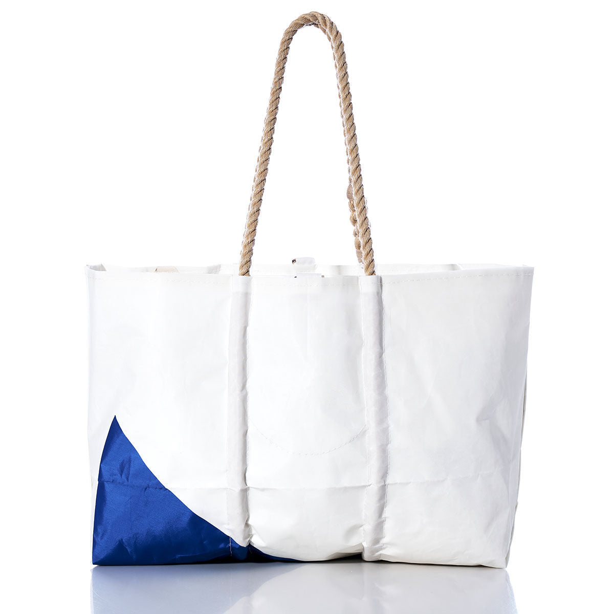 Sea Bags Vintage Etchells Large Tote: A white tote bag featuring a blue corner accent and rope handles, inspired by classic sailboat totes, shown against a white background. by Sea Bags