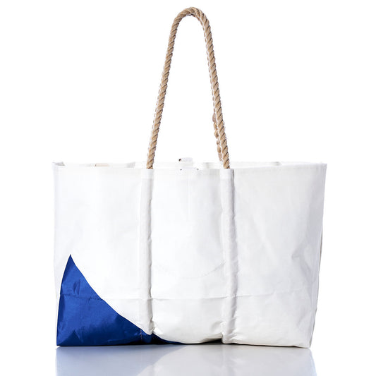 Sea Bags Vintage Etchells Large Tote: A white tote bag featuring a blue corner accent and rope handles, inspired by classic sailboat totes, shown against a white background. by Sea Bags