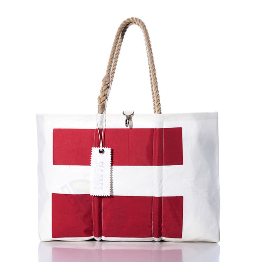 The Sea Bags Vintage Sonar Large Tote features authentic sailcloth materials, two red horizontal stripes on a white background, sturdy rope handles, and a distinctive white front tag. Inspired by handmade Maine bags, it showcases classic nautical style and lasting craftsmanship. by Sea Bags