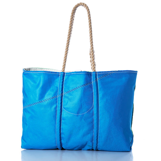 A blue and green large tote bag from Sea Bags, featuring zigzag stitching and two beige hand-spliced rope handles inspired by Maine handcrafted bags, is shown against a white background. by Sea Bags