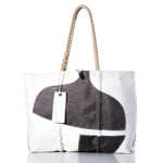 Sea Bags Vintage Pacific Seacraft Large Tote—features a white body, thick rope handles, black abstract shapes on the front, and two rectangular tags near the handle; inspired by classic sailboat tote bag designs. by Sea Bags