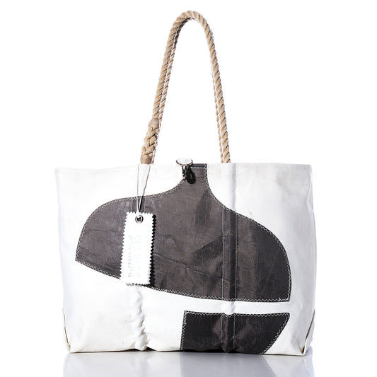 Sea Bags Vintage Pacific Seacraft Large Tote—features a white body, thick rope handles, black abstract shapes on the front, and two rectangular tags near the handle; inspired by classic sailboat tote bag designs. by Sea Bags