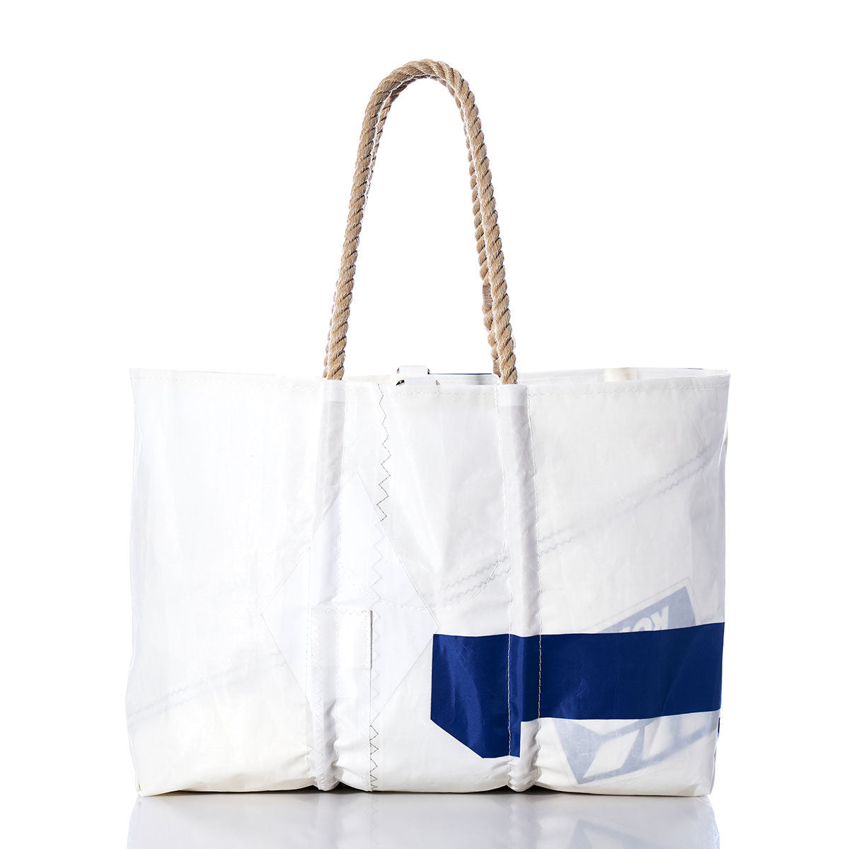 The Sea Bags Vintage 541 Large Tote, displayed on a plain white background, features hand-spliced rope handles, visible stitching, and a striking blue diagonal stripe. Handcrafted in Maine, this spacious white tote captures classic nautical style reminiscent of a vintage sail bag. by Sea Bags