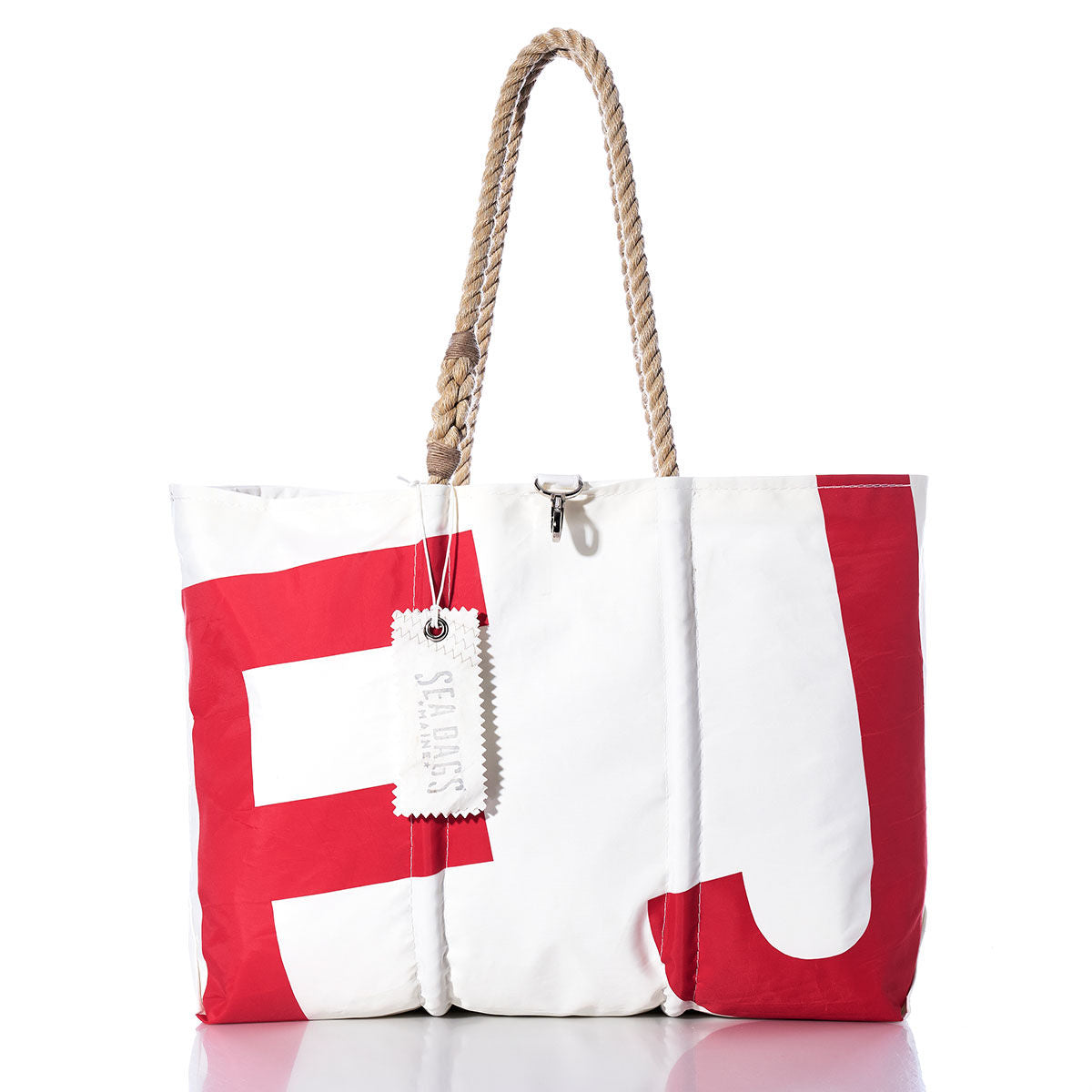The Sea Bags Vintage FJ Large Tote features a white body with bold red lettering, hand-spliced rope handles, and a white tag labeled Sea Bags. The tote is shown standing upright against a white background. by Sea Bags