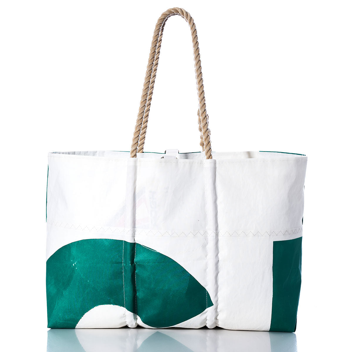 Sea Bags’ Vintage 15 Large Tote features a white body with a green geometric pattern, hand-spliced rope handles, and distinctive zigzag stitching. Displayed on a reflective surface against a white background, this bag is an elegant tribute to Maine-crafted designs and classic vintage sail totes. by Sea Bags