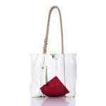 The Sea Bags Vintage Red Square Handbag features a white tote design with hemp rope handles, a bold red geometric patch on the front inspired by classic sail insignias, and a signature white SEA BAGS tag attached to the handle, shown against a white background. by Sea Bags
