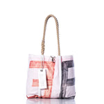 A Sea Bags Vintage 36 Handbag tote with hemp rope handles, showcasing a red and black abstract sail insignia pattern and a white tag, displayed on a white background. by Sea Bags