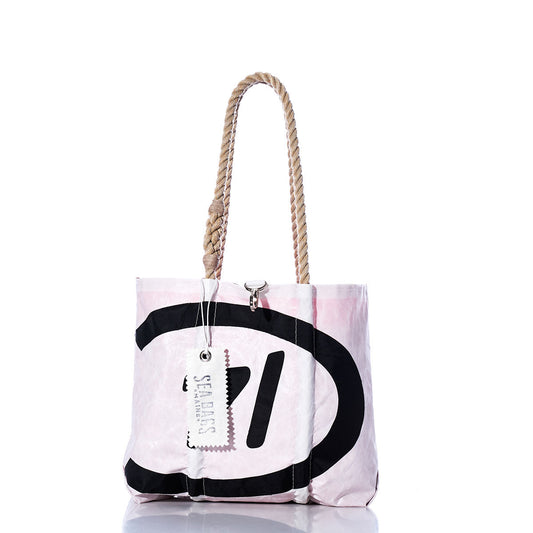 The Vintage C14 Handbag by Sea Bags features hemp rope handles, a pink and white body, bold black graphics inspired by classic sail insignias, and a branded Sea Bags tag. by Sea Bags