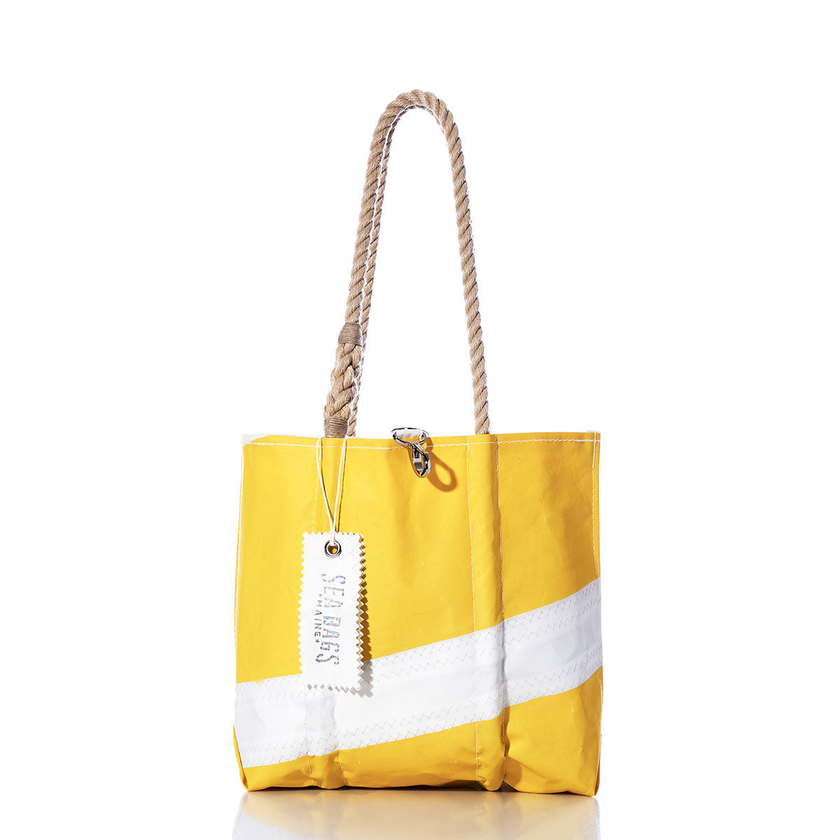 The Sea Bags Vintage Yellow and White Handbag is showcased against a plain white background, featuring bold white diagonal stripes, sturdy hemp rope handles, and a distinctive white tag labeled with the brands name. by Sea Bags