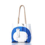 The Vintage Blue CA Handbag by Sea Bags features a white and blue design, sturdy hemp rope handles, and a rectangular tag, shown against a white background. by Sea Bags