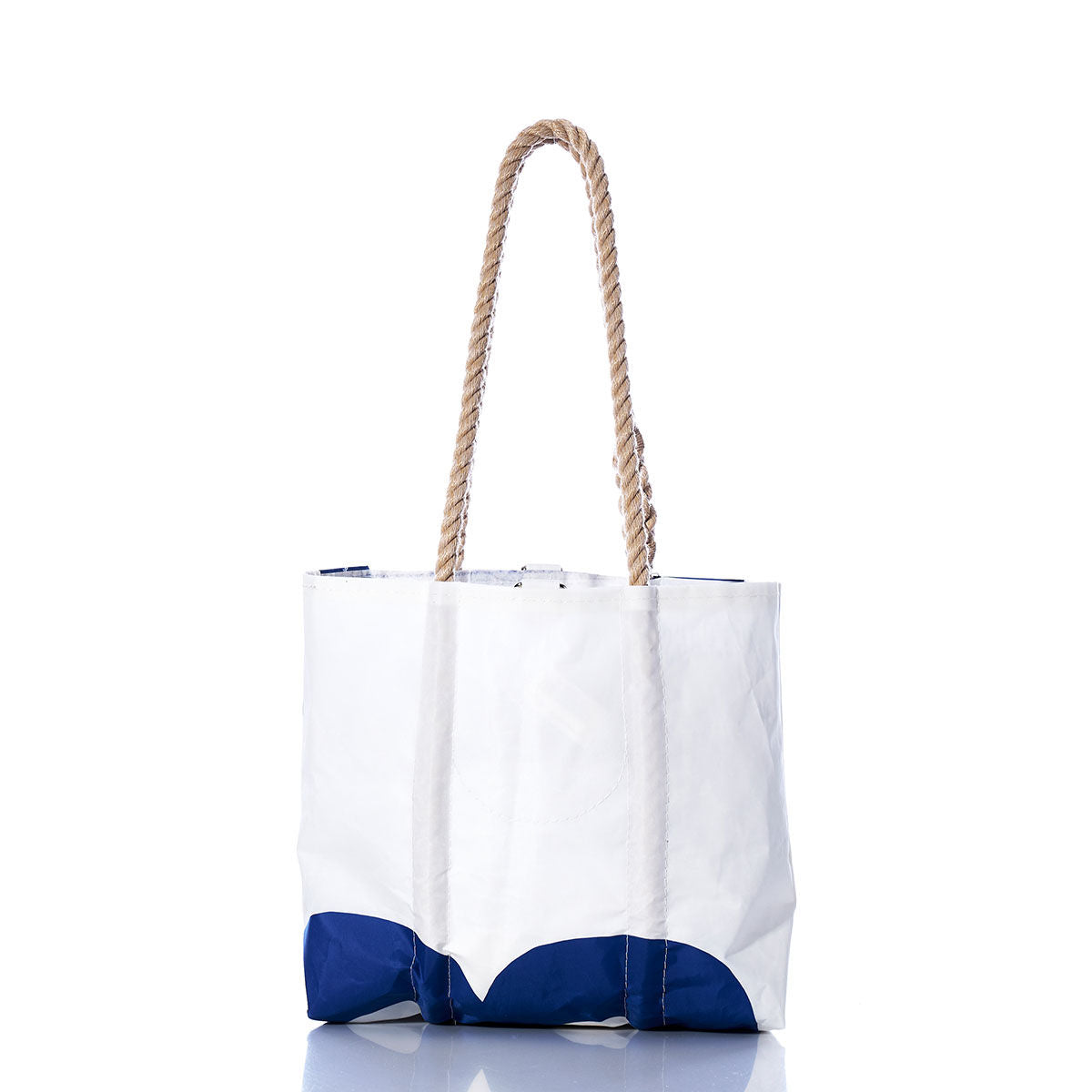 Sea Bags Vintage Blue 63 Handbag—a white tote featuring bold blue accents at the bottom and two sturdy hemp rope handles—shown against a plain white background. by Sea Bags
