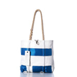 The Vintage 15 Handbag by Sea Bags is a white and blue tote featuring sturdy hemp rope handles and a white tag labeled Sea Bags, photographed on a white background. Inspired by the classic vintage handbag, this piece blends nautical style with timeless appeal. by Sea Bags