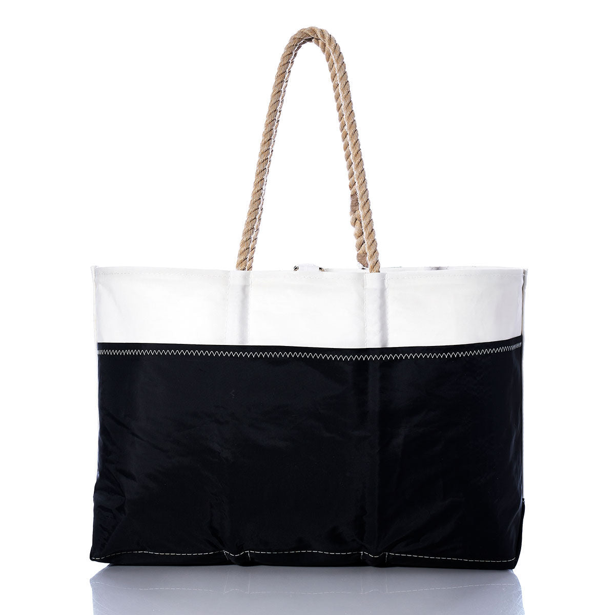 Sea Bags Vintage Shannon Ogunquit Beach Tote, crafted from recycled sail cloth in black and white and featuring two rope handles, is photographed on a plain white background. This eco-friendly tote offers vintage-inspired style perfect for the beach. by Sea Bags