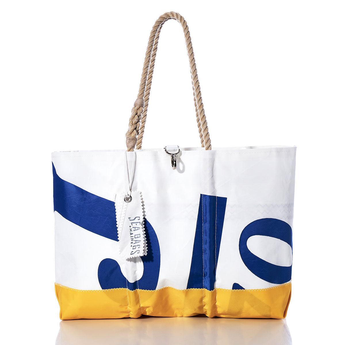 Vintage J70 Ogunquit Beach Tote by Sea Bags, crafted from recycled sail cloth in white, blue, and yellow with rope handles and a “Sea Bags” tag, displayed on a white background. by Sea Bags