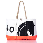 The Vintage Beneteau Ogunquit Beach Tote by Sea Bags features white and orange panels, sturdy rope handles, a black printed design, and a SEA BAGS tag. Crafted from recycled sail cloth, this tote bag is photographed against a white background. by Sea Bags