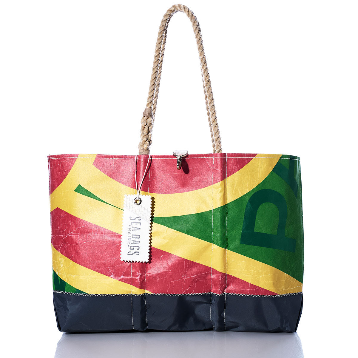 Sea Bags Vintage Multicolor Ogunquit Beach Tote is a large beach bag crafted from colorful recycled sailcloth in red, yellow, green, and black sections, featuring sturdy rope handles and a Sea Bags brand tag. by Sea Bags