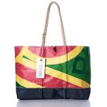 Sea Bags Vintage Multicolor Ogunquit Beach Tote is a large beach bag crafted from colorful recycled sailcloth in red, yellow, green, and black sections, featuring sturdy rope handles and a Sea Bags brand tag. by Sea Bags