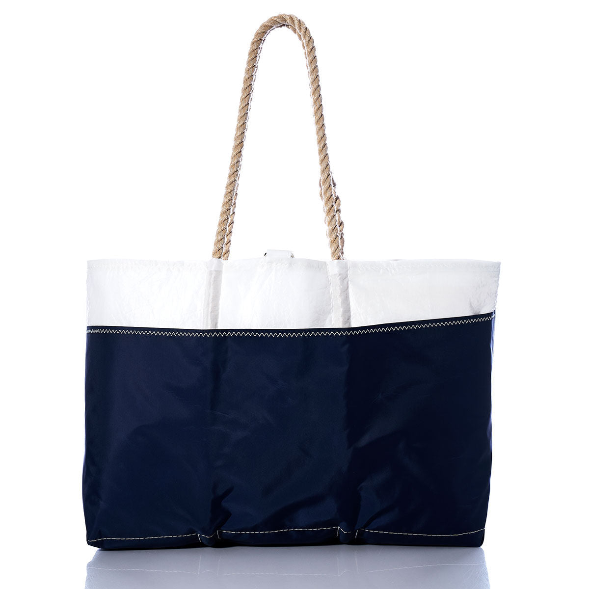 Vintage red Ogunquit Beach Tote with thick rope handles, crafted from recycled sail cloth by Sea Bags, photographed against a white background. by Sea Bags