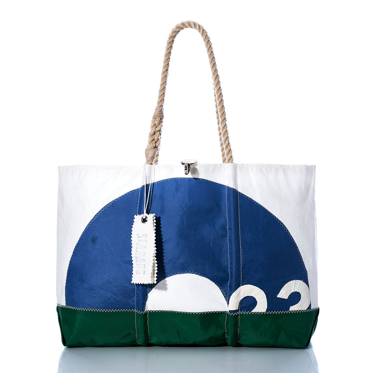 Sea Bags Vintage O-Day Ogunquit Beach Tote, crafted from white, blue, and green recycled sail cloth with rope handles, features a circular design and a stitched white tag. by Sea Bags