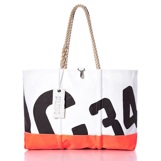 Introducing the Vintage Crealock 34 Ogunquit Beach Tote by Sea Bags—a white and orange tote made from recycled sail cloth, adorned with bold black numbers, sturdy rope handles, and a signature SEA BAGS tag—a distinctive accessory inspired by the iconic Crealock 34. by Sea Bags