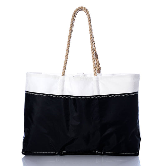 Sea Bags Vintage Red 2 Ogunquit Beach Tote features a spacious design with a black bottom, a white top section crafted from recycled sail cloth, visible stitching, and sturdy rope handles. Photographed against a white background, this tote blends coastal style with durable construction. by Sea Bags