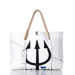 Handmade in Portland, Maine, the Sea Bags Vintage Black Trident Wharf Tote is crafted from recycled sails and features rope handles, distinctive zigzag stitching, and a bold black trident graphic. The tote includes a white tag labeled “Sea Bags” and is photographed against a white background. by Sea Bags